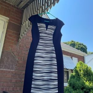 Woman’s navy and white striped dress